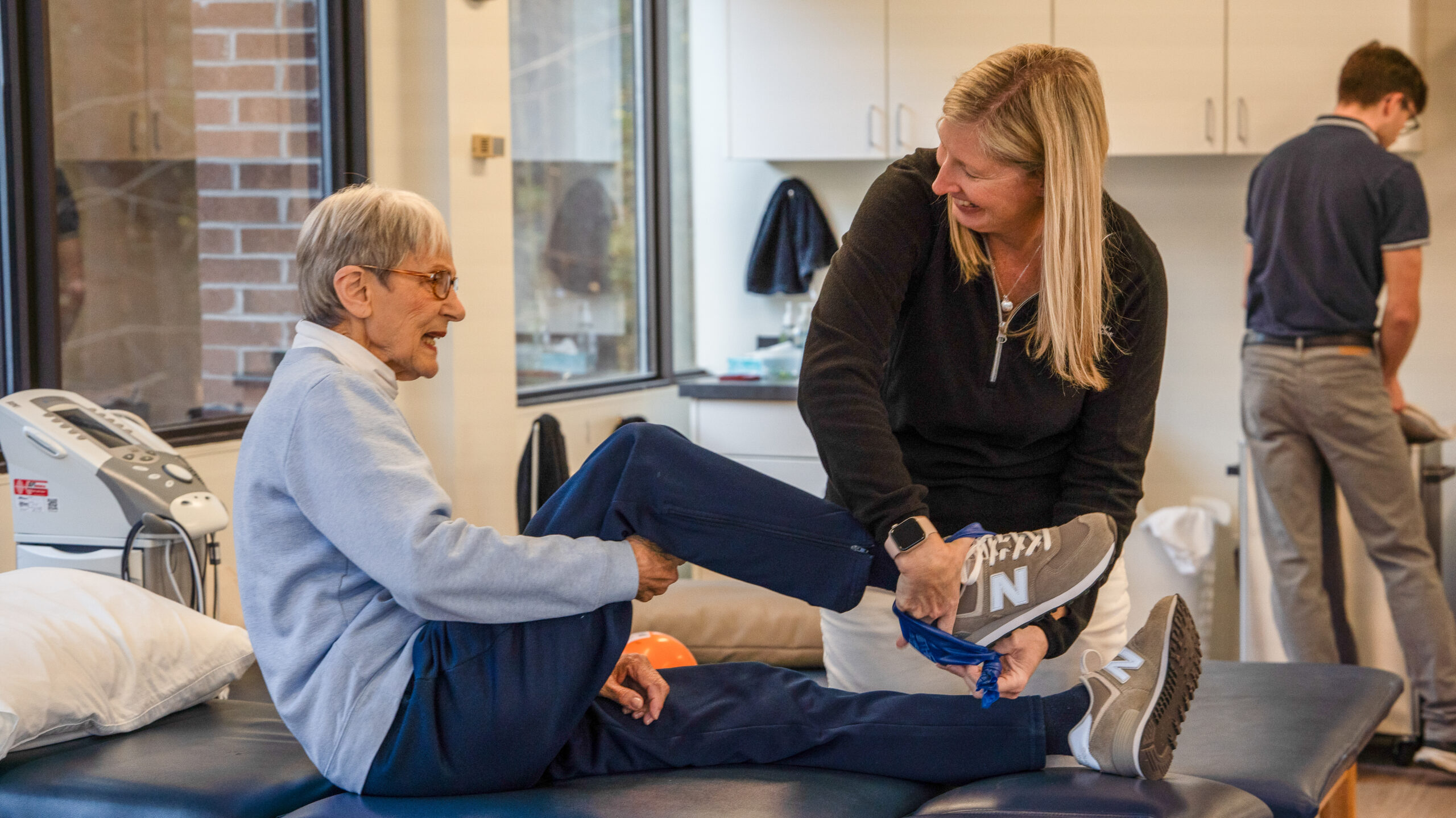 Physical Therapy & Sports Medicine Centers (PTSMC) of Avon physical therapist treating female patient's foot on treatment table