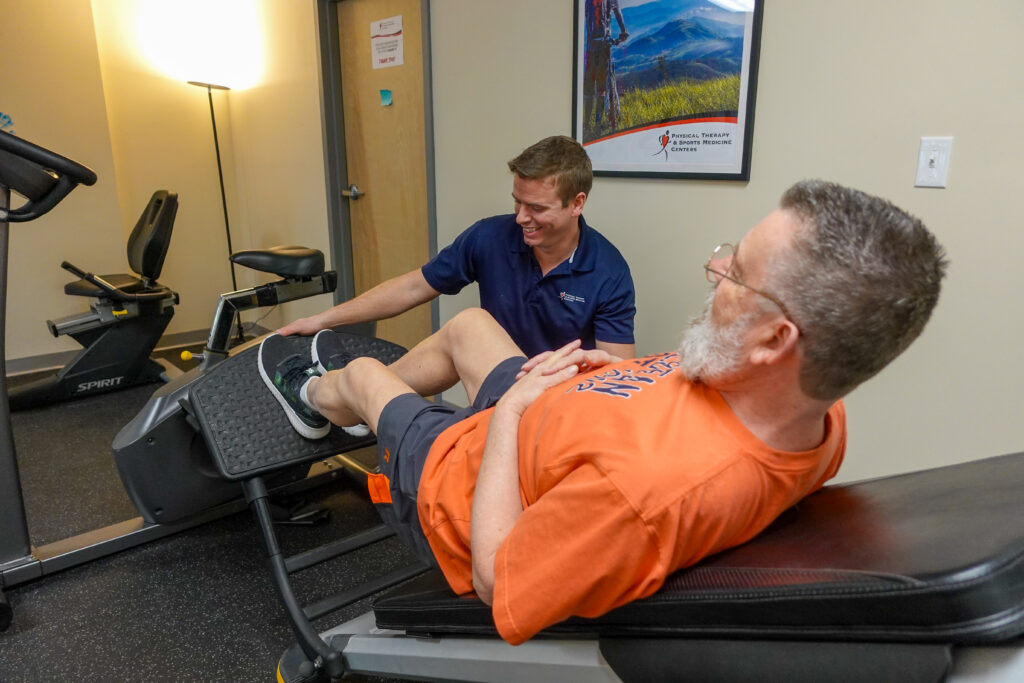 New Milford Physical Therapist and patient on leg press 