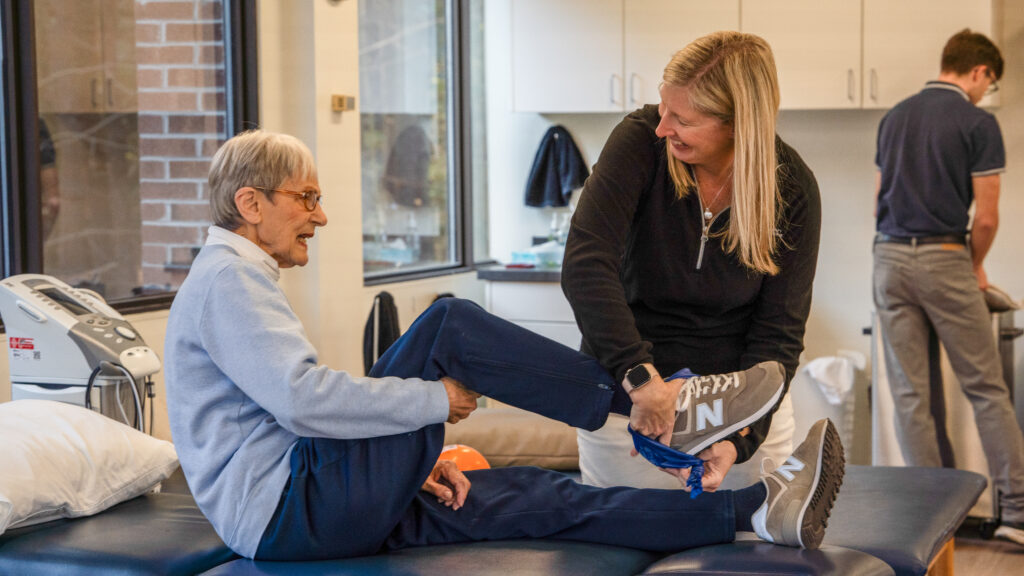 Avon Physical Therapist Kristin Gilbey treating female patients foot