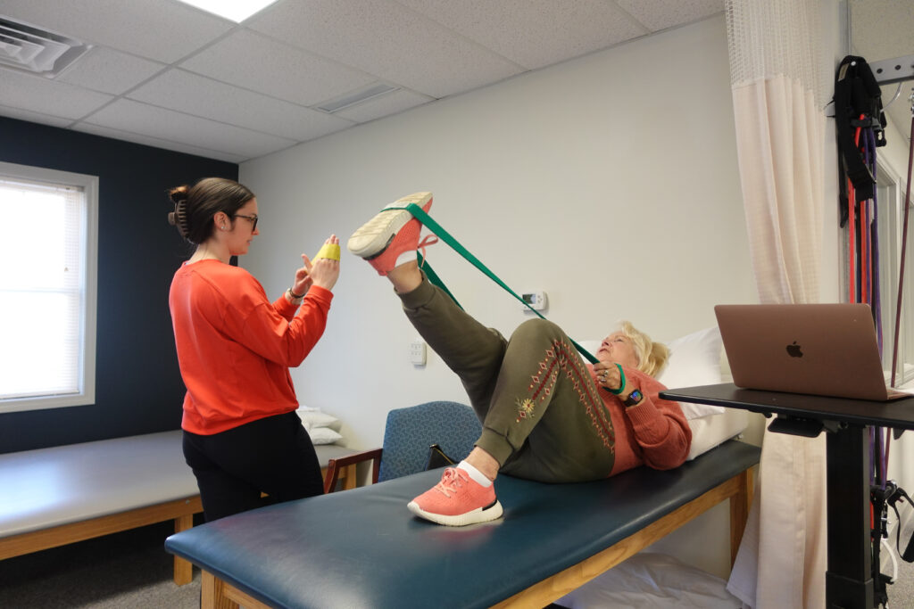 Essex Physical Therapist and patient doing leg exercises