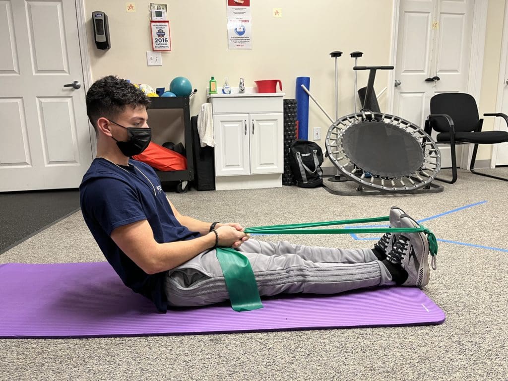 Seated calf stretch with a resistance band