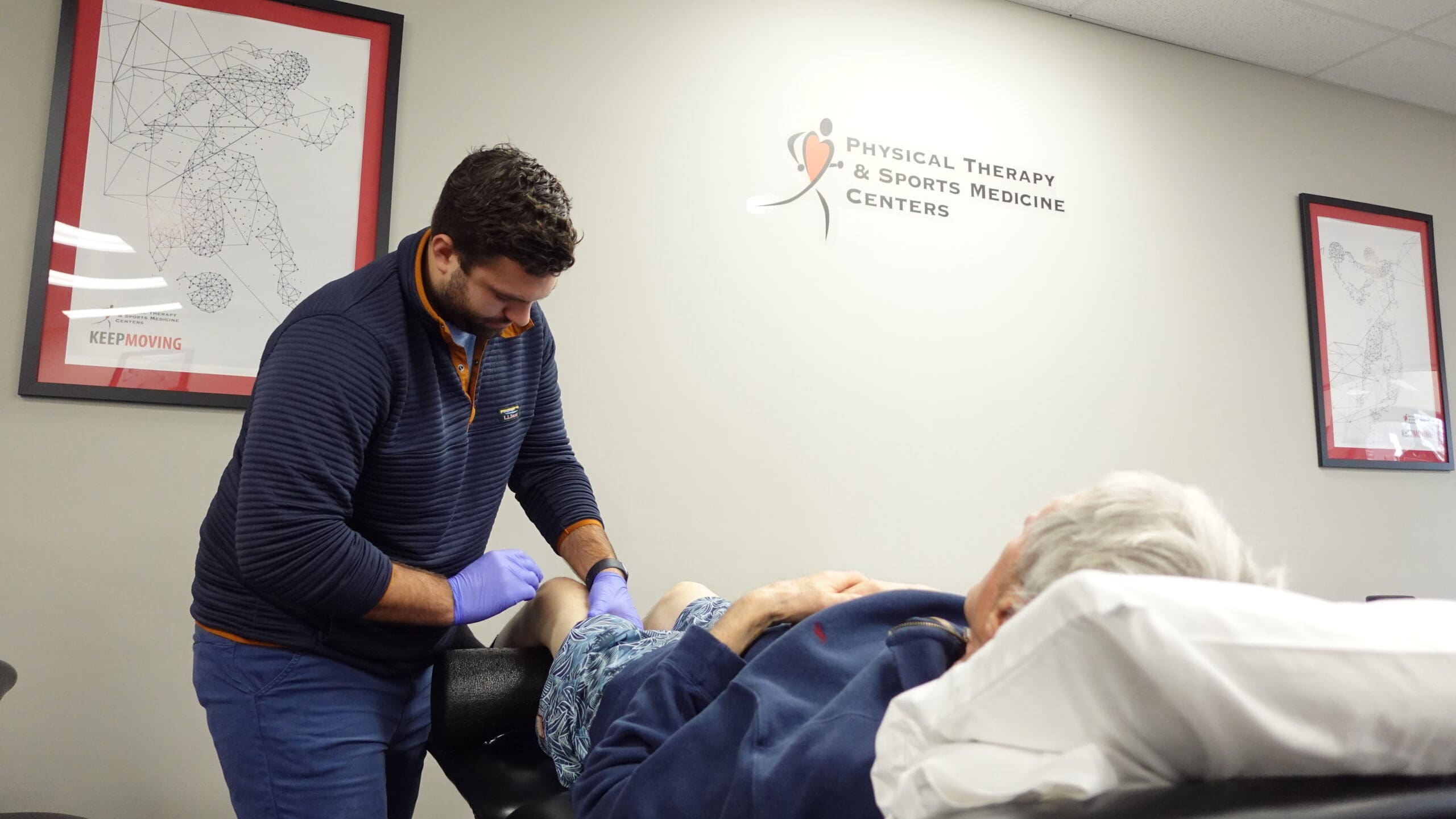 PTSMC Fairfield Andrew Kalach treating male patient's leg